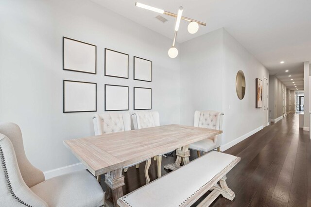 dining room with recessed lighting, baseboards, and dark wood-style flooring