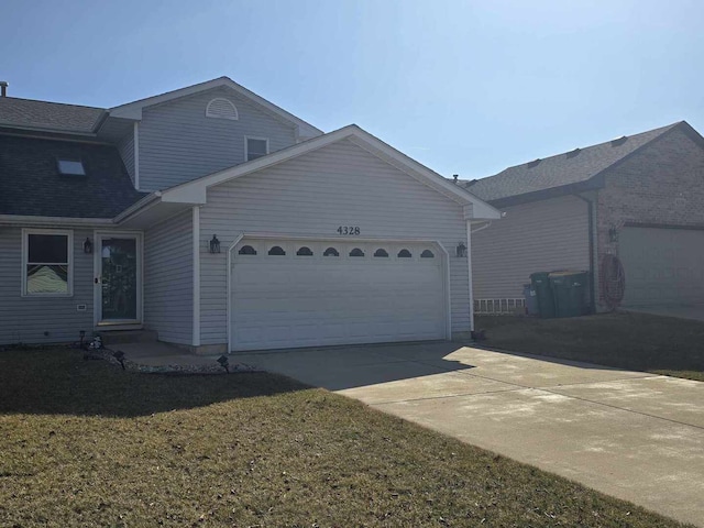 view of front of house with a garage and driveway