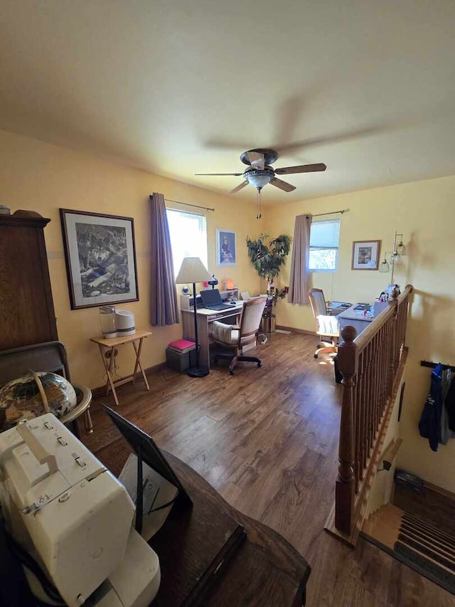 office space with a ceiling fan and wood finished floors