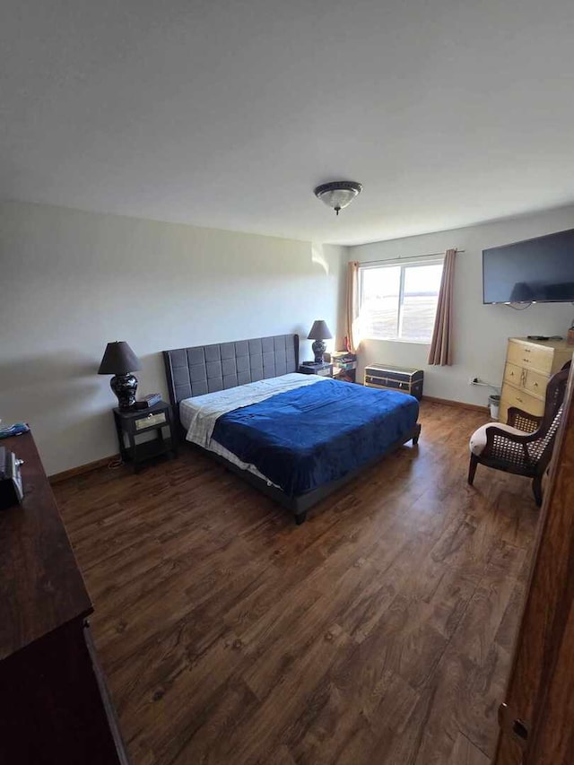 bedroom featuring wood finished floors