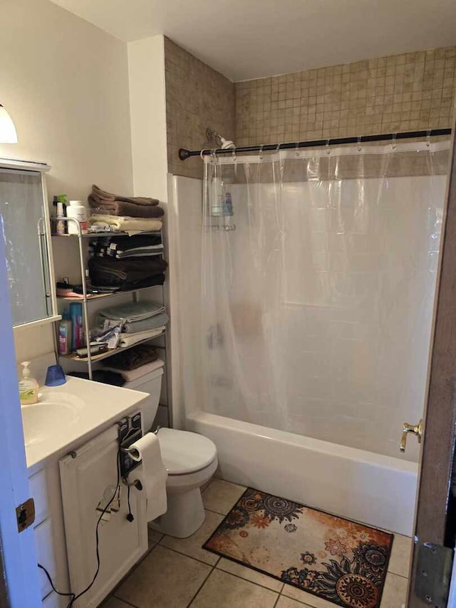 full bathroom with tile patterned floors, shower / bath combination with curtain, toilet, and vanity