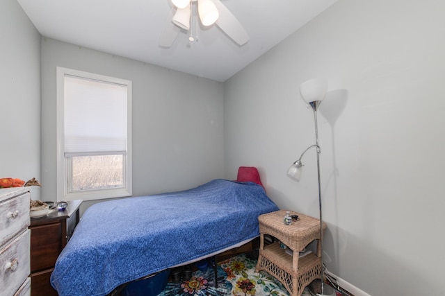 bedroom with baseboards and ceiling fan