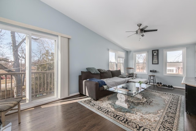 living area with ceiling fan, baseboards, lofted ceiling, and wood finished floors