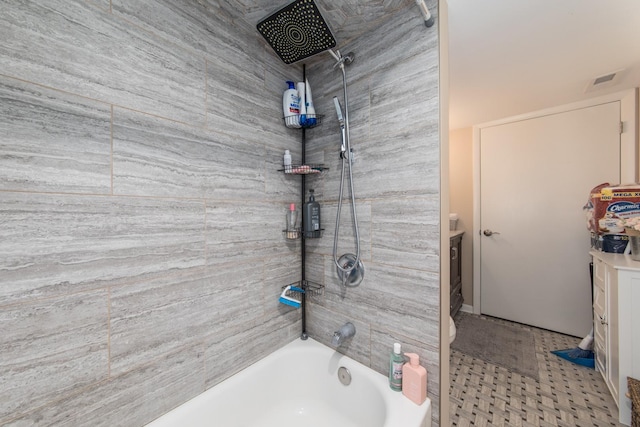 bathroom featuring visible vents and shower / tub combination