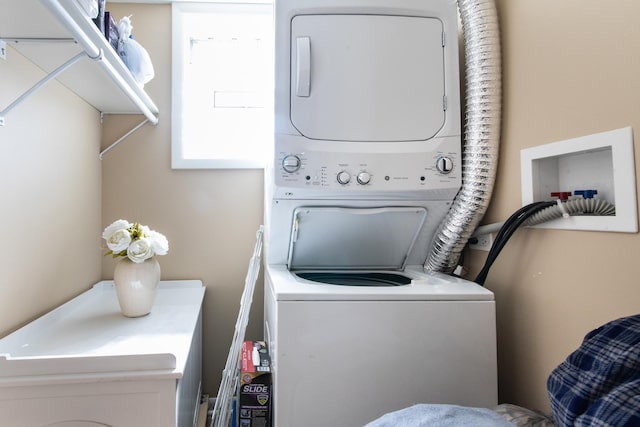 laundry room with laundry area and stacked washer and dryer