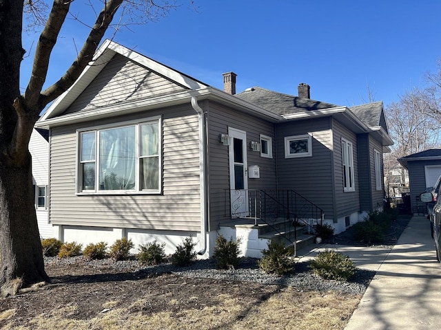 view of front of property with a chimney