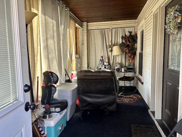 sunroom featuring wood ceiling