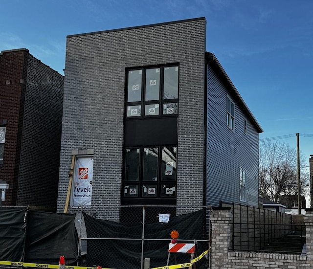 view of front of house with brick siding