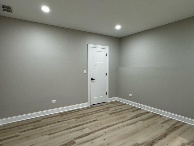 unfurnished room with recessed lighting, visible vents, baseboards, and light wood-style flooring