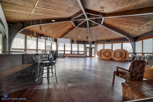 unfurnished living room with plenty of natural light and wood-type flooring