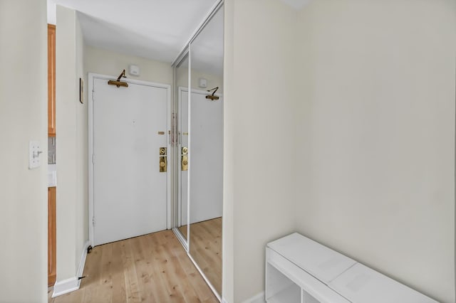 hallway featuring light wood finished floors