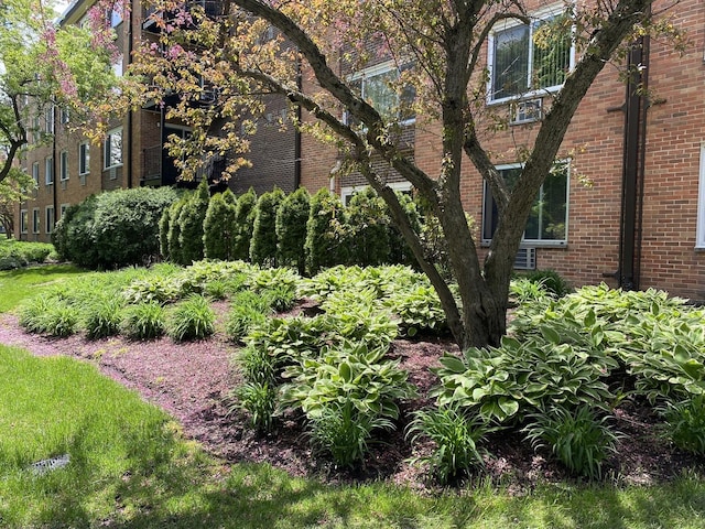 view of side of property featuring brick siding