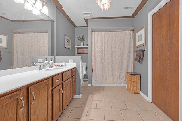 bathroom featuring visible vents, toilet, vanity, and crown molding