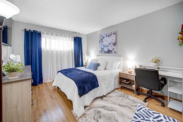 bedroom with wood finished floors