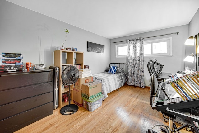 bedroom featuring wood finished floors