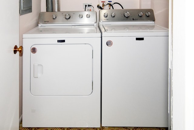 clothes washing area featuring laundry area and washer and dryer