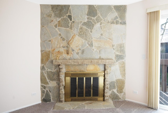 interior details with a fireplace, baseboards, and carpet floors