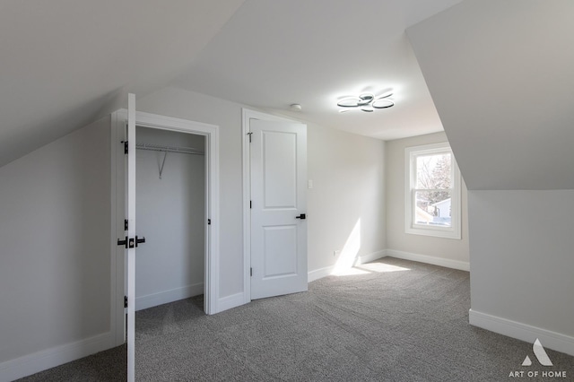 bonus room featuring baseboards, carpet floors, and vaulted ceiling