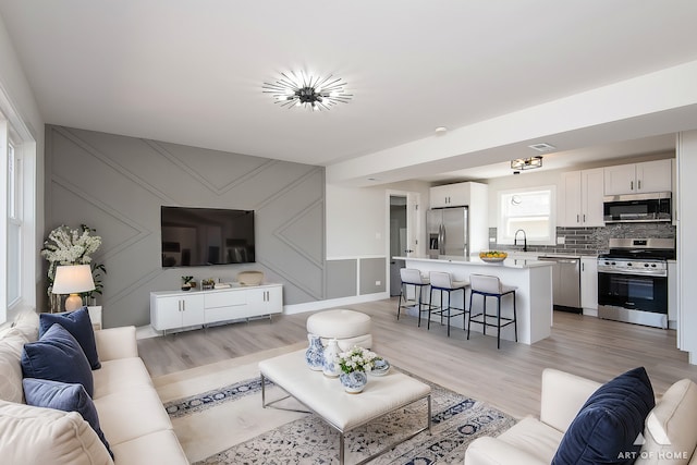 living area with light wood-style floors