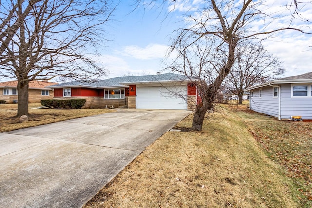 ranch-style house featuring stone siding, driveway, a front yard, and a garage