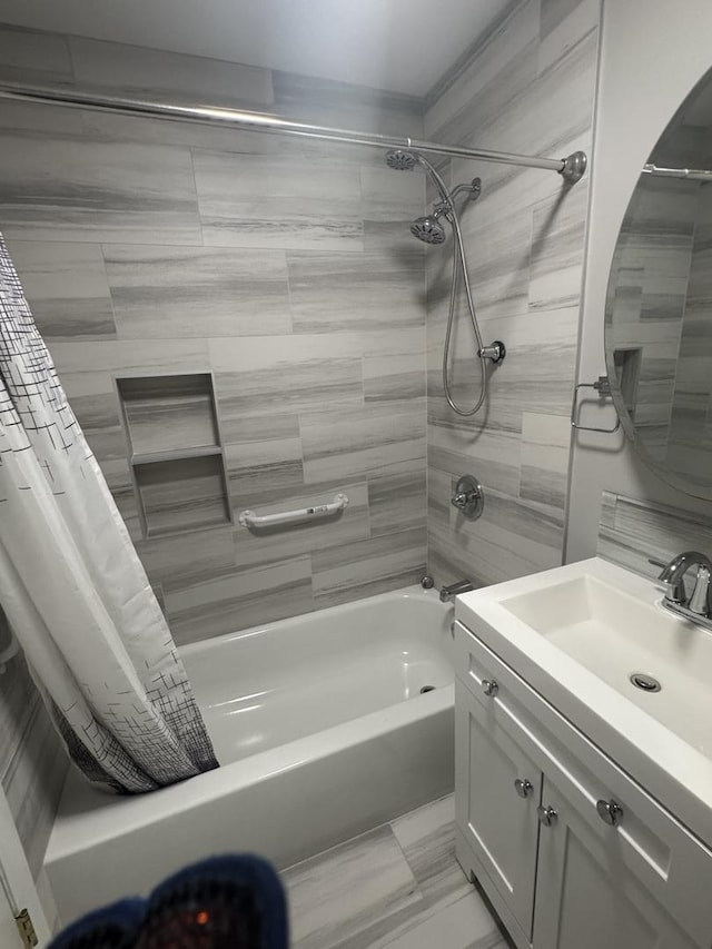 bathroom with shower / bath combo and vanity