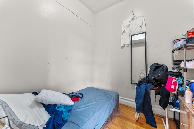 bedroom with wood finished floors