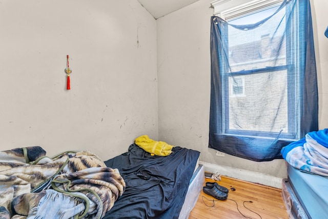 bedroom featuring wood finished floors