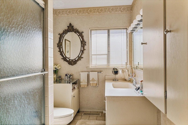 full bathroom with tile patterned floors, toilet, a stall shower, and vanity