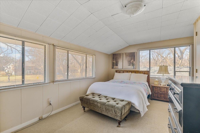 bedroom with light carpet and vaulted ceiling