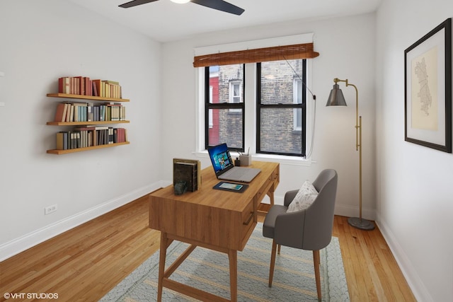 office space featuring ceiling fan, baseboards, and wood finished floors