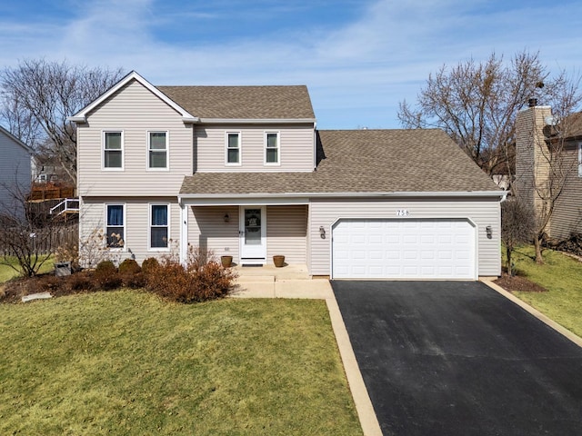 view of front of home featuring a front yard, an attached garage, driveway, and roof with shingles