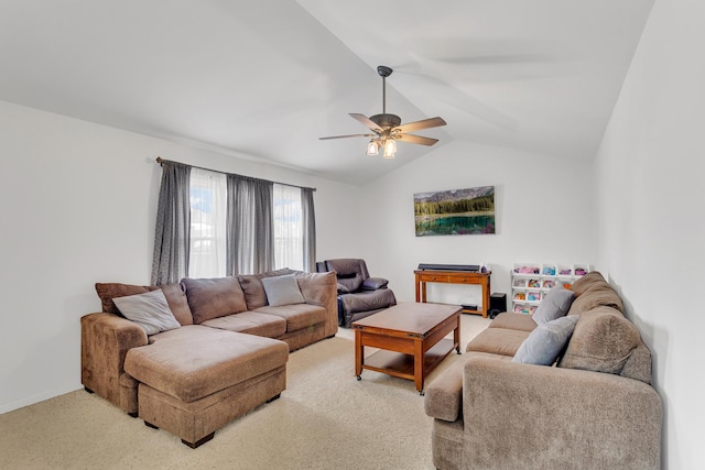 living area with baseboards, light colored carpet, a ceiling fan, and lofted ceiling