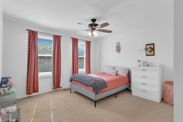 carpeted bedroom with a ceiling fan