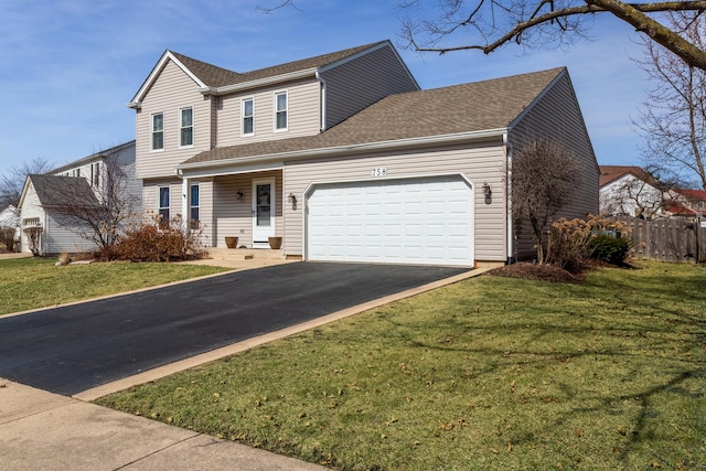 traditional home with a front yard, fence, a shingled roof, a garage, and aphalt driveway