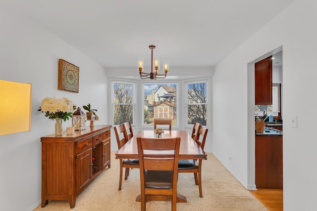 dining area featuring a chandelier