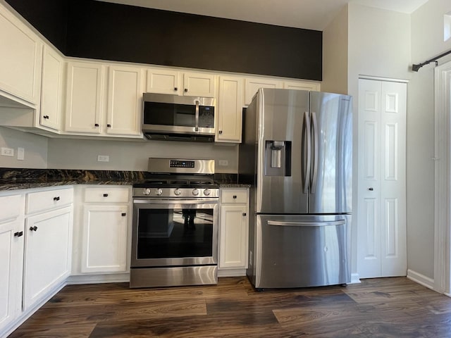 kitchen with white cabinets, dark wood-style floors, and stainless steel appliances