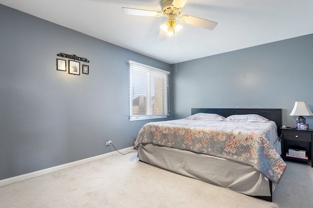 bedroom featuring a ceiling fan, baseboards, and carpet floors