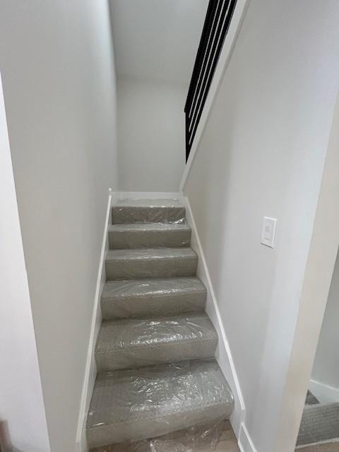 stairs featuring baseboards