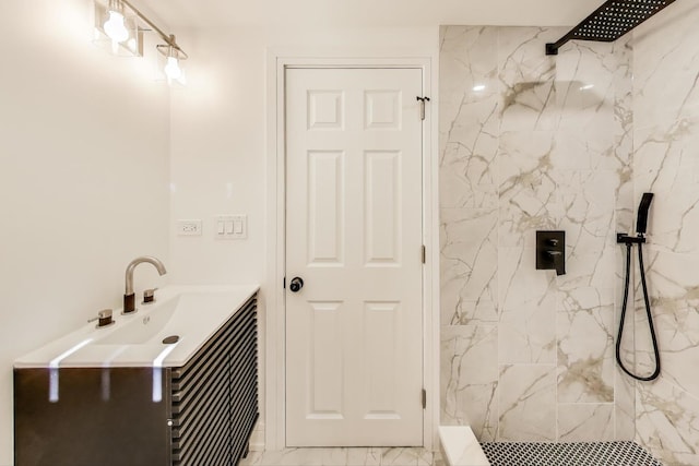 bathroom with vanity, marble finish floor, and a marble finish shower