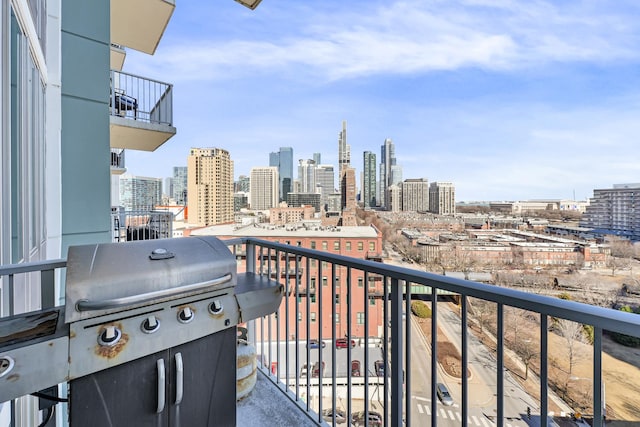 balcony with a city view and a grill