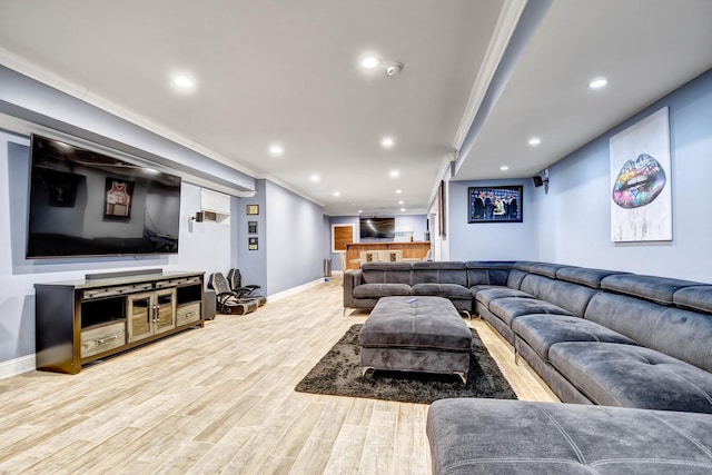 living room featuring recessed lighting, wood finished floors, and baseboards