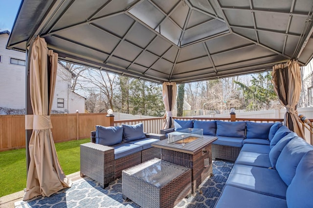 view of patio featuring an outdoor living space with a fire pit, a gazebo, and a fenced backyard