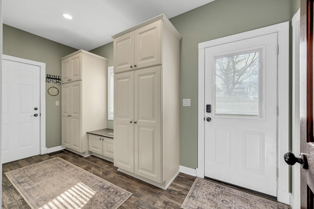 entryway with recessed lighting, baseboards, and dark wood-type flooring