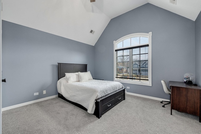 bedroom featuring baseboards, carpet, and vaulted ceiling