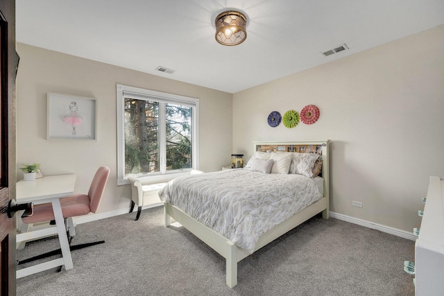 carpeted bedroom with visible vents and baseboards