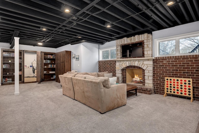 carpeted living area with a fireplace and a wealth of natural light