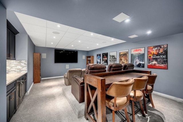 home theater room featuring recessed lighting, baseboards, and light colored carpet