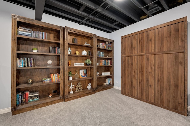 interior space with visible vents, baseboards, and carpet