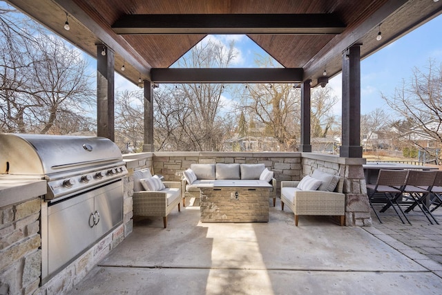 view of patio / terrace featuring area for grilling, an outdoor hangout area, and exterior kitchen