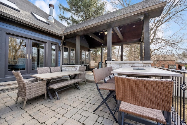 view of patio / terrace featuring outdoor dining space, french doors, and an outdoor hangout area